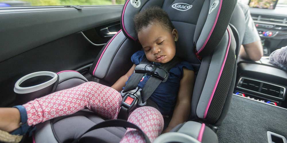 How old must a child be to ride in the front seat shop of a car